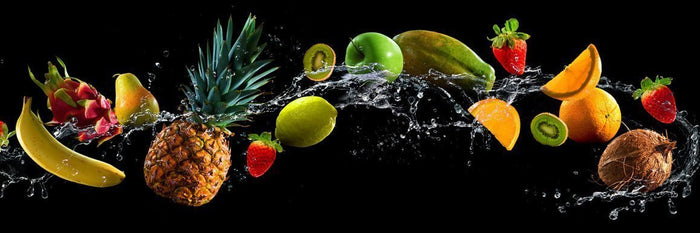 Fruit and water spray on black background