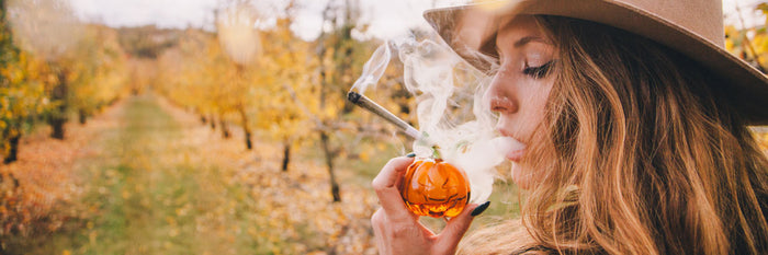 Young girl smoking weed on a farm in autumn