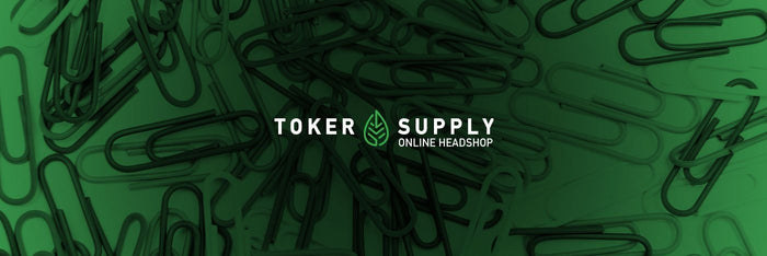 Toker Supply logo over paper clips for DIY smoking tips